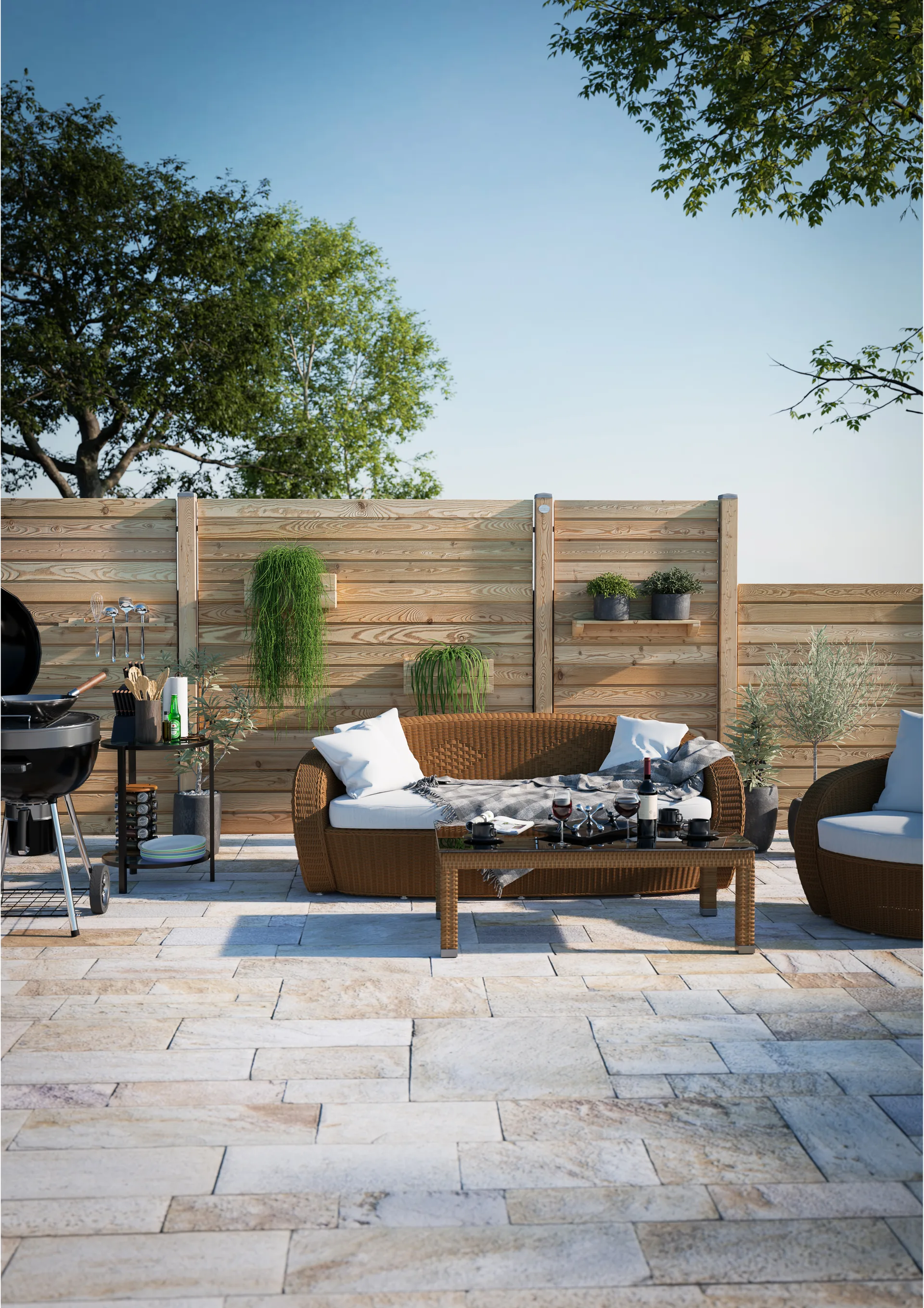 Terrasse mit Holzzaun, Loungemöbeln und Grill